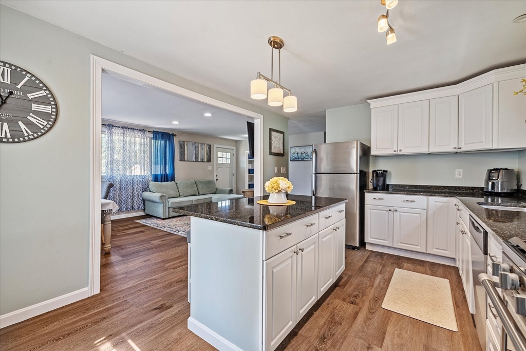 14 Grosvenor Street Ayer, MA 01432 - Photo 8 of 30 a kitchen with stainless steel appliances granite countertop a stove and cabinets
