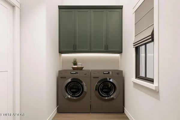 a utility room with dryer and washer