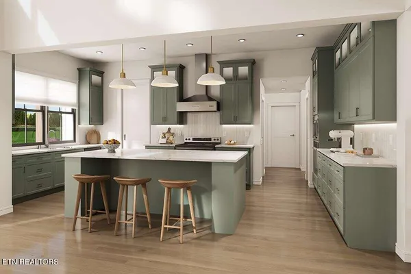 a kitchen with a sink and chairs