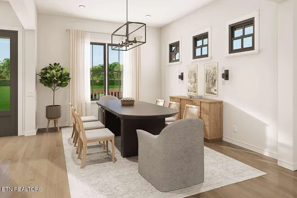 a living room with furniture a chandelier and a window