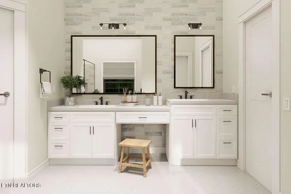 a spacious bathroom with a sink vanity and mirror