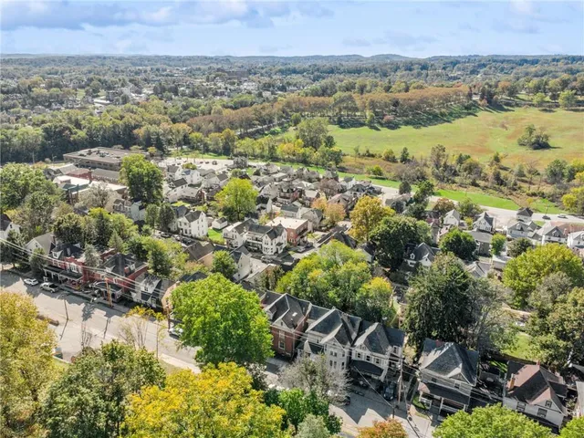an aerial view of a city and mountains