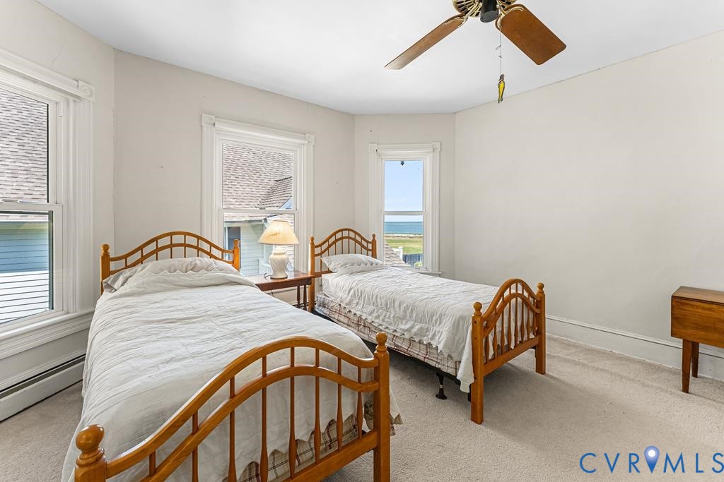 2414 Windmill Point Road White Stone, VA 22578 - Photo 36 of 72 a bedroom with two beds and a dresser