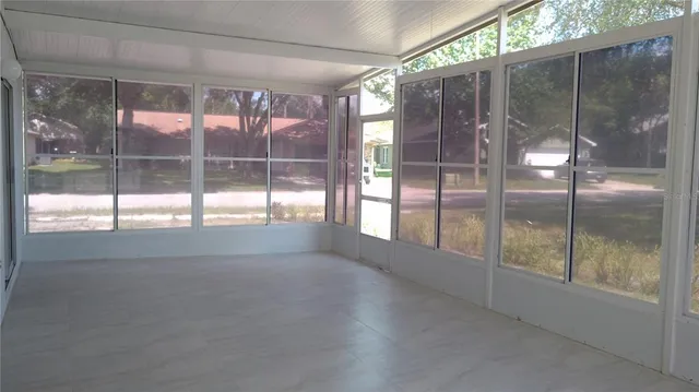 a view of empty room with sliding glass door