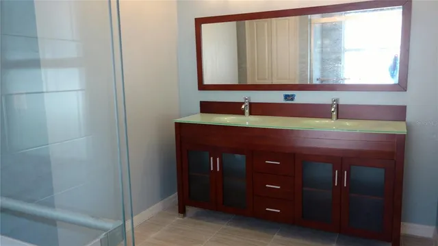 a bathroom with a sink and a mirror