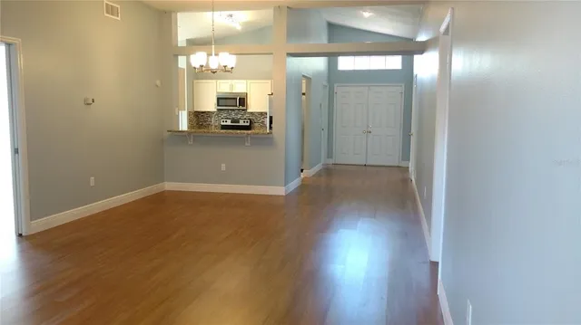 a view of gallery with wooden floor
