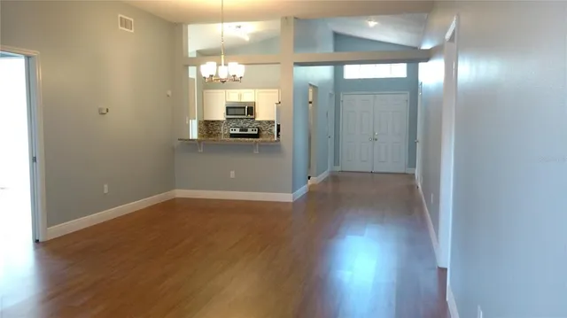 a view of a bathroom with a sink and a mirror
