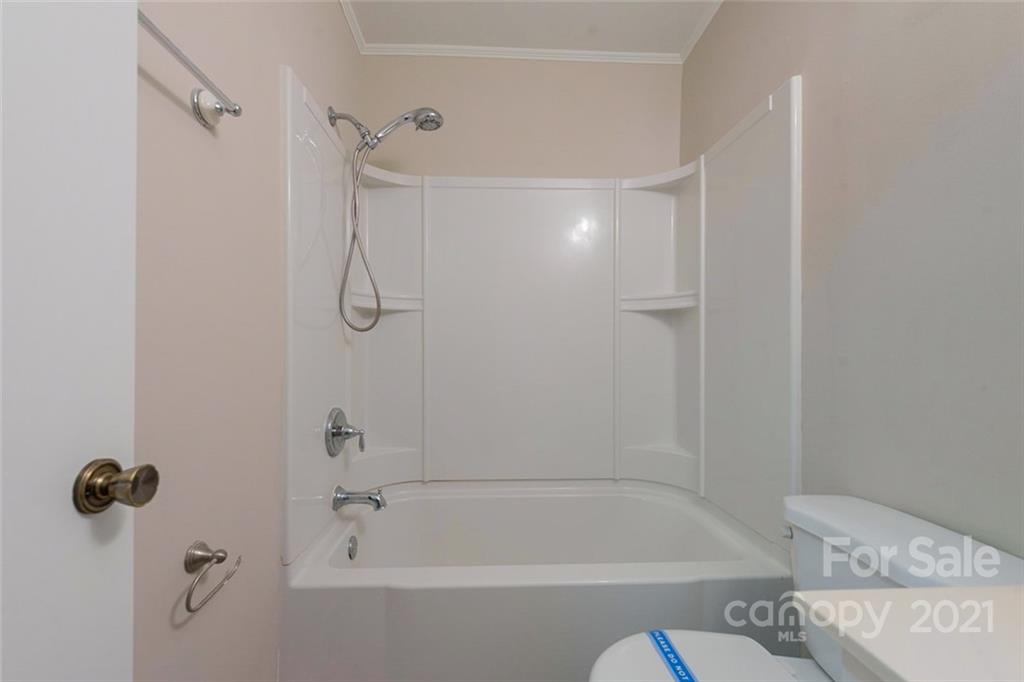 1593 Brook Drive Fort Mill, SC 29708 - Photo 14 of 18 a bathroom with a shower and a bath tub