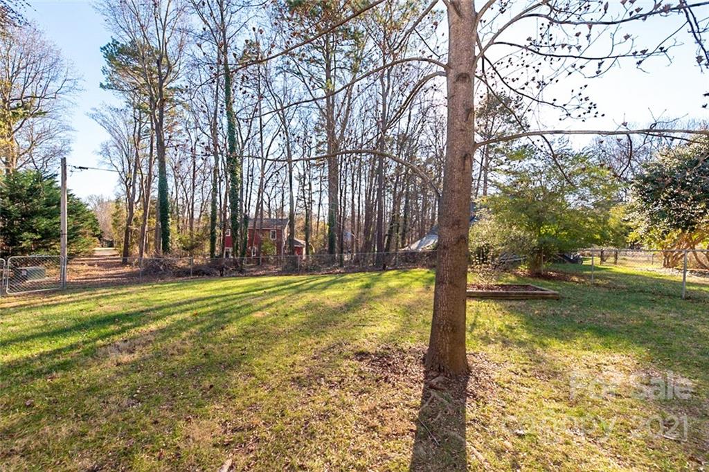 1593 Brook Drive Fort Mill, SC 29708 - Photo 16 of 18 a view of a yard with trees