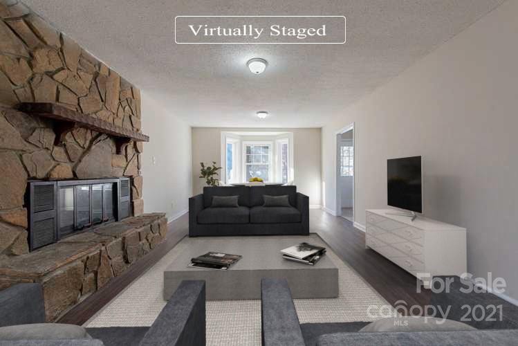 1593 Brook Drive Fort Mill, SC 29708 - Photo 2 of 18 a living room with furniture and a flat screen tv