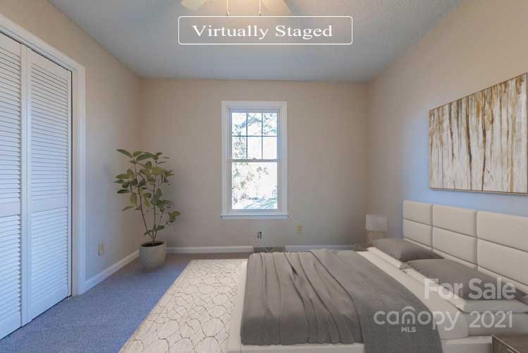 1593 Brook Drive Fort Mill, SC 29708 - Photo 3 of 18 a bedroom with a bed and a window