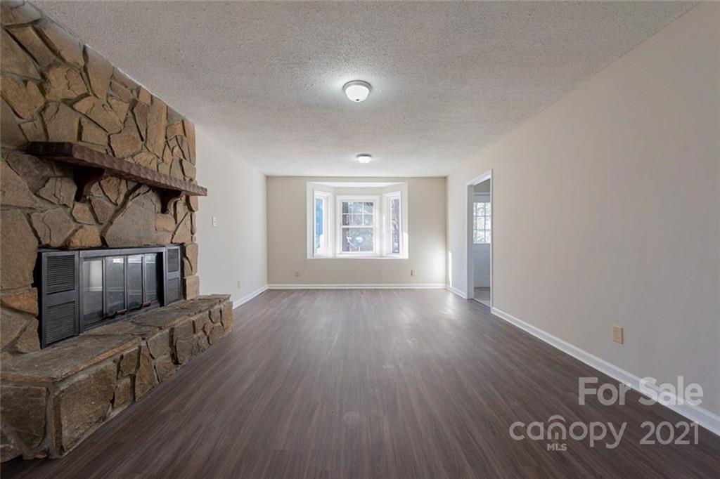 1593 Brook Drive Fort Mill, SC 29708 - Photo 5 of 18 a view of an empty room with wooden floor and a window