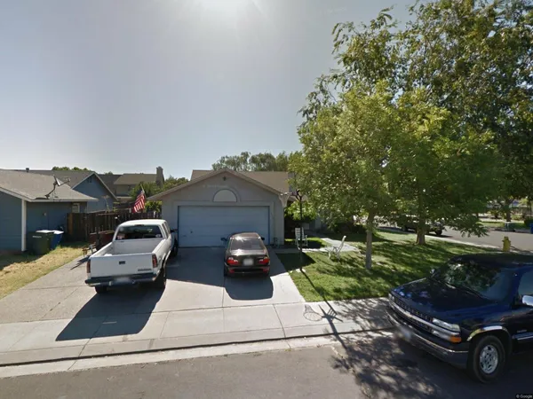 a car parked in front of a house