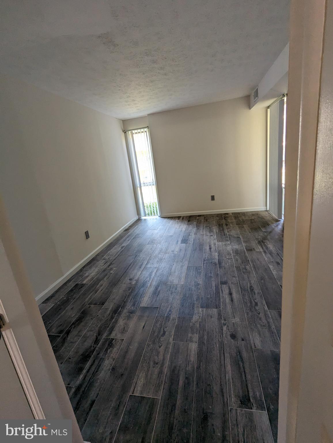 7252 Donnell Place, Unit A2 District Heights, MD 20747 - Photo 11 of 12 a view of a room with wooden floor