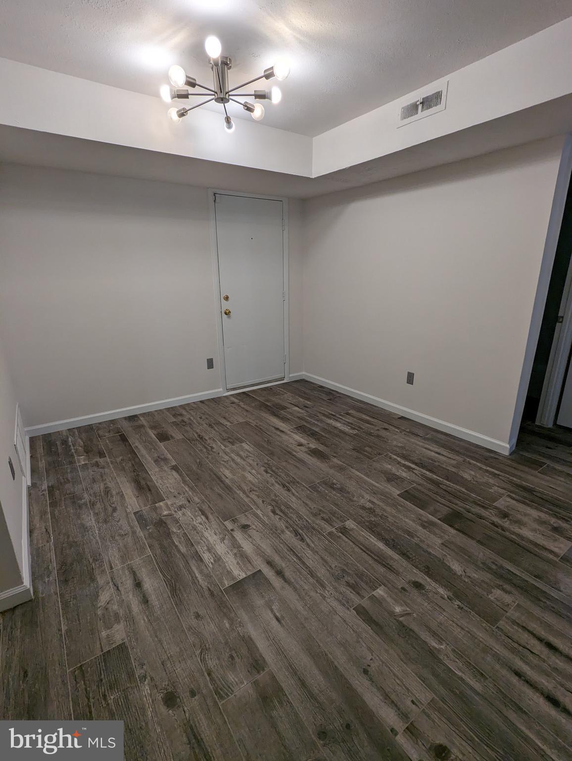 7252 Donnell Place, Unit A2 District Heights, MD 20747 - Photo 6 of 12 a view of a room with wooden floor