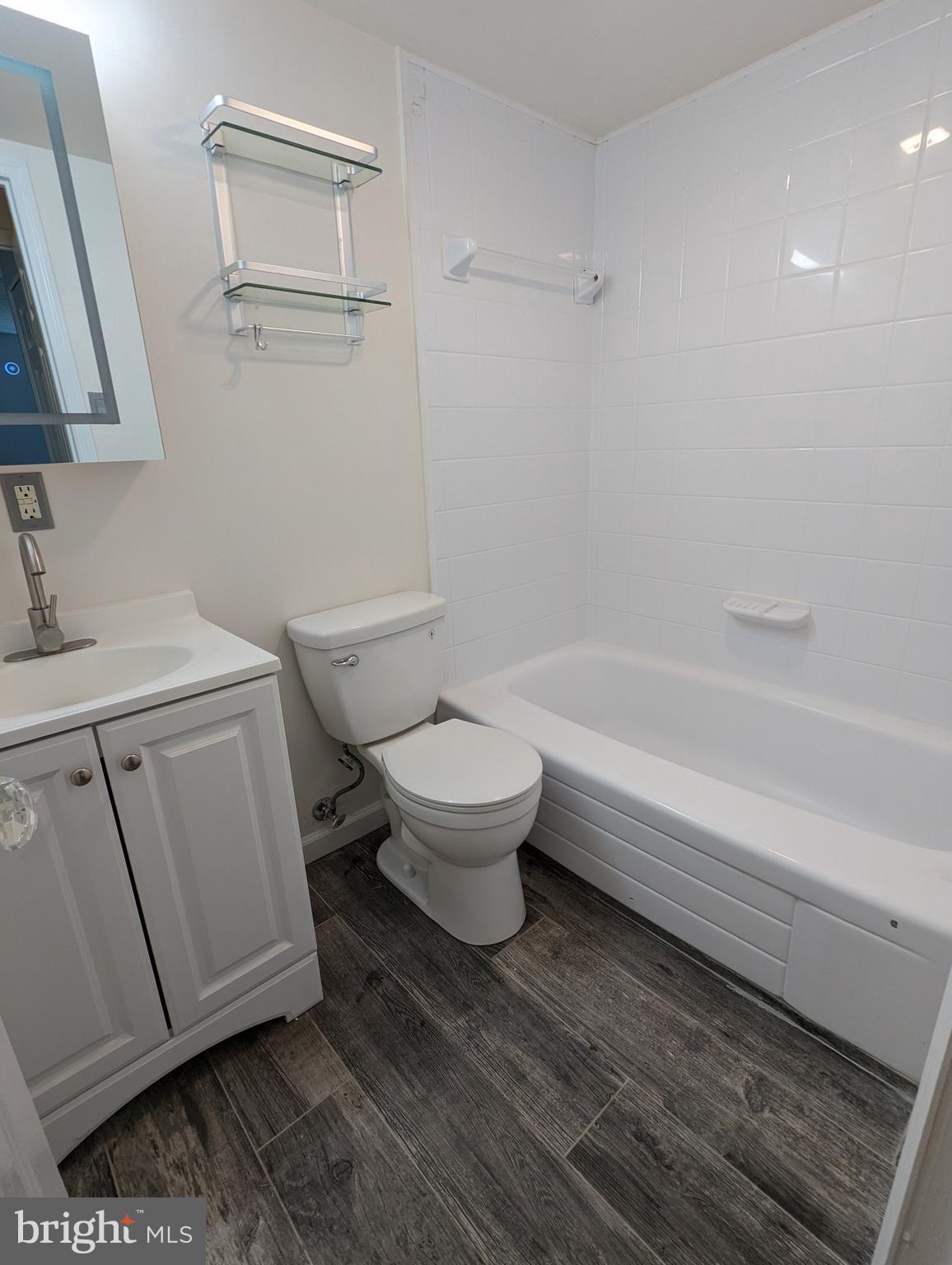 7252 Donnell Place, Unit A2 District Heights, MD 20747 - Photo 8 of 12 a bathroom with a toilet a sink and bathtub