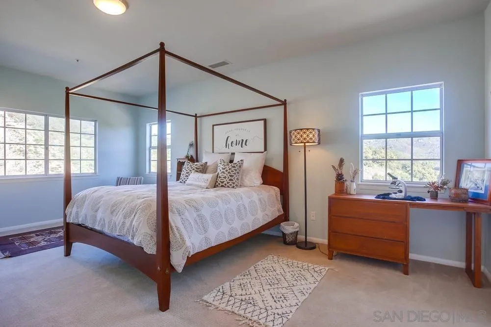 39221 Daily Road Fallbrook, CA 92028 - Photo 18 of 26 a bedroom with a bed and window