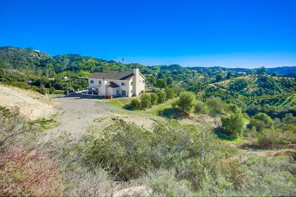 39221 Daily Road Fallbrook, CA 92028 - Photo 21 of 26 a view of a house with a yard
