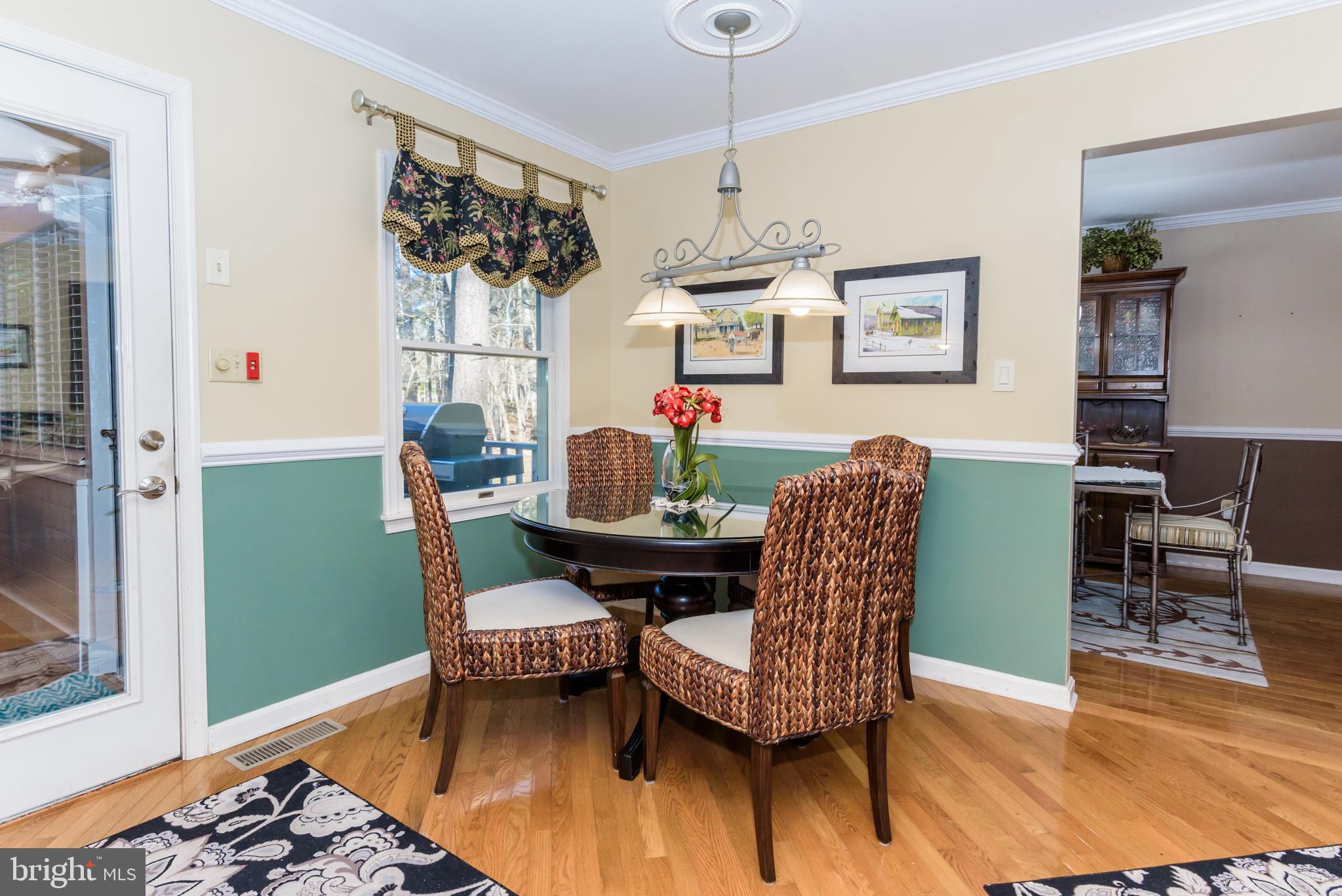 11 Drawbridge Road Berlin, MD 21811 - Photo 27 of 78 a view of a dining room with furniture and wooden floor