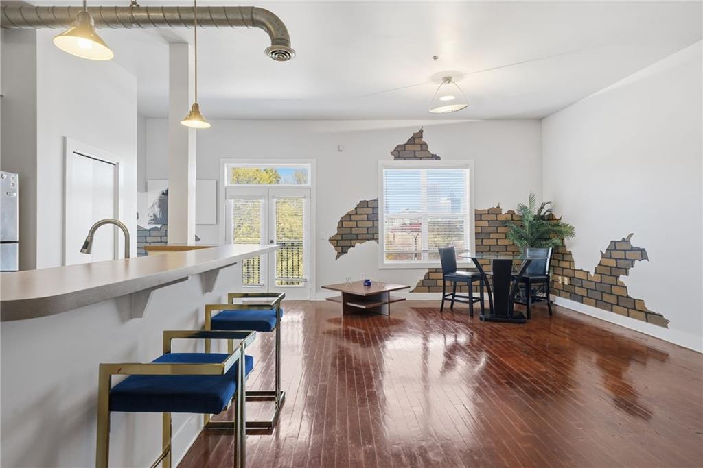 502 Pryor Street Southwest, Unit 328 Atlanta, GA 30312 - Photo 12 of 46 a living room with furniture and wooden floor