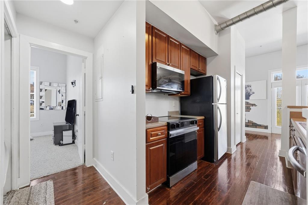 502 Pryor Street Southwest, Unit 328 Atlanta, GA 30312 - Photo 16 of 46 a kitchen with stainless steel appliances a refrigerator stove and microwave
