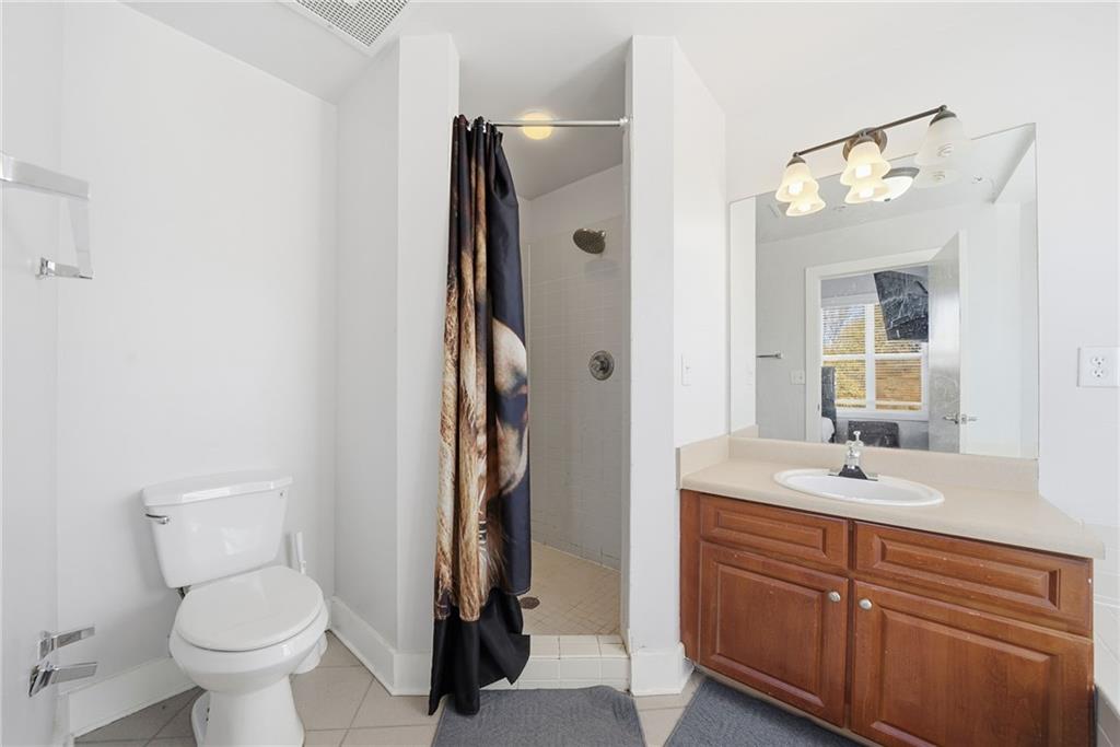 502 Pryor Street Southwest, Unit 328 Atlanta, GA 30312 - Photo 18 of 46 a bathroom with a sink toilet and shower