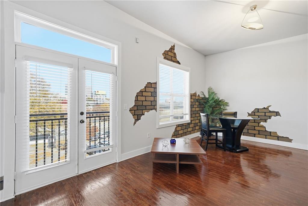 502 Pryor Street Southwest, Unit 328 Atlanta, GA 30312 - Photo 2 of 46 a living room with furniture and wooden floor