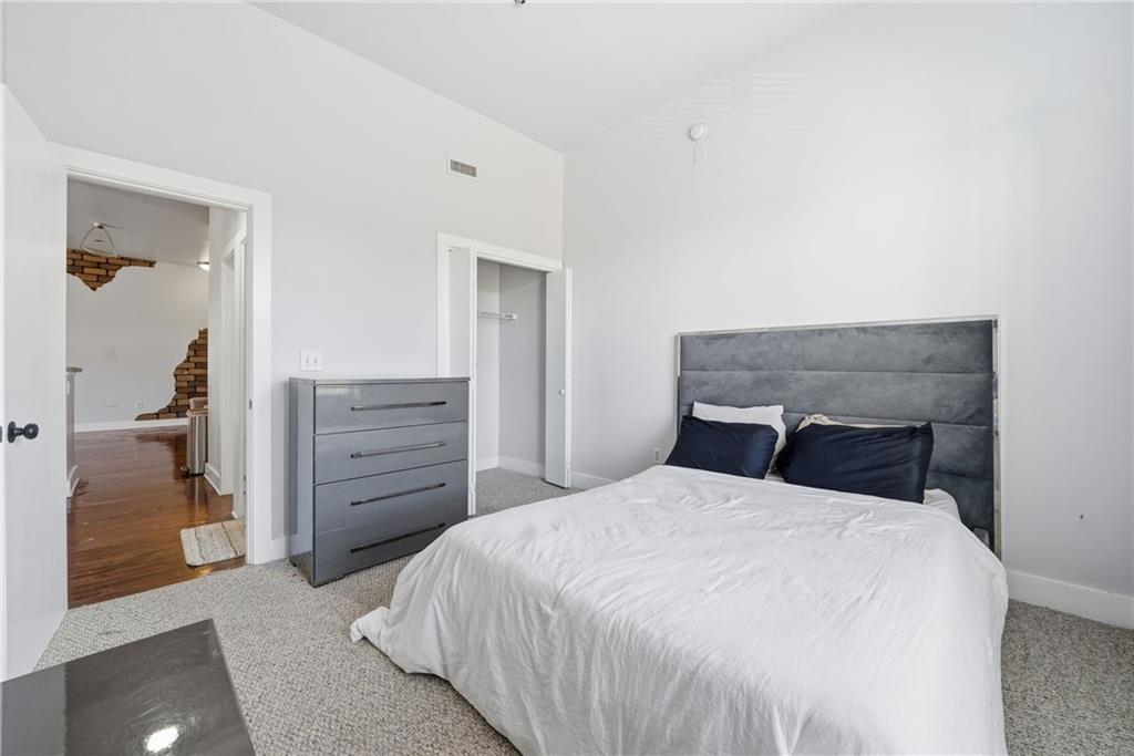 502 Pryor Street Southwest, Unit 328 Atlanta, GA 30312 - Photo 28 of 46 a bedroom with a bed and furniture