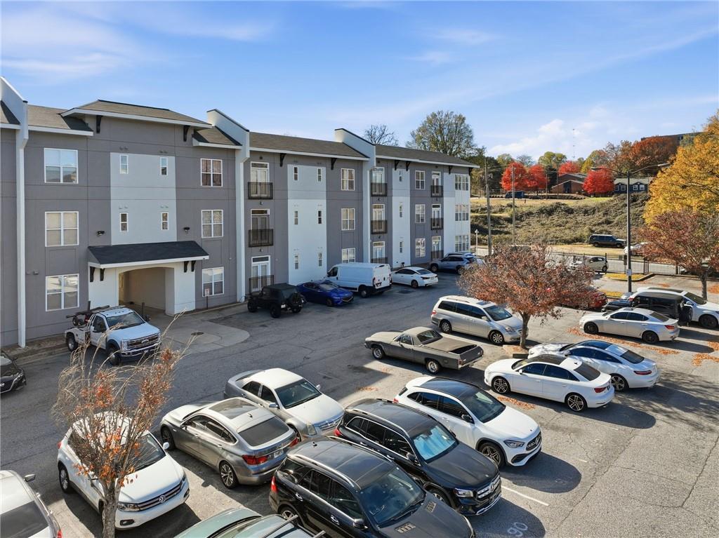 502 Pryor Street Southwest, Unit 328 Atlanta, GA 30312 - Photo 32 of 46 a view of a patio with couches chairs and a fire pit