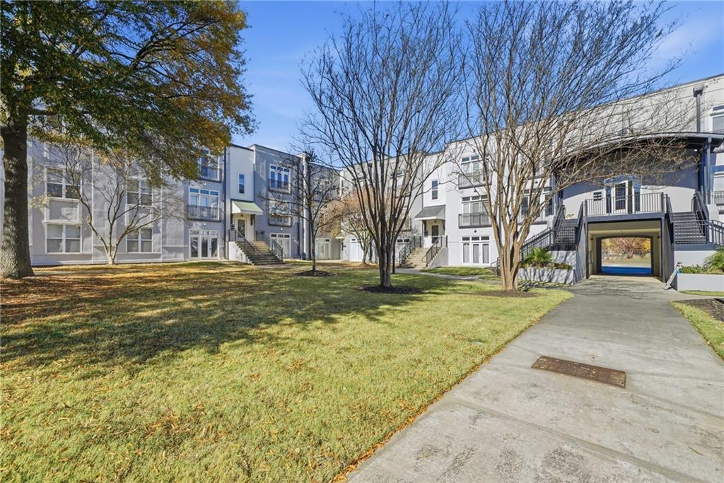 502 Pryor Street Southwest, Unit 328 Atlanta, GA 30312 - Photo 42 of 46 a front view of a building with large trees