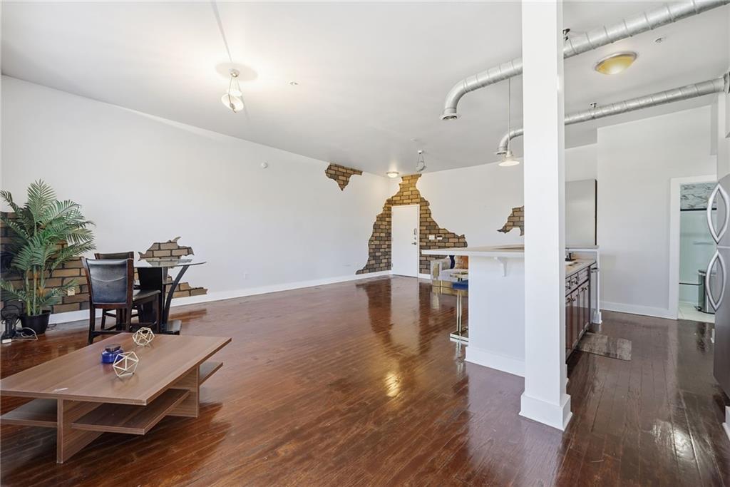 502 Pryor Street Southwest, Unit 328 Atlanta, GA 30312 - Photo 10 of 46 a view of a livingroom with furniture and wooden floor