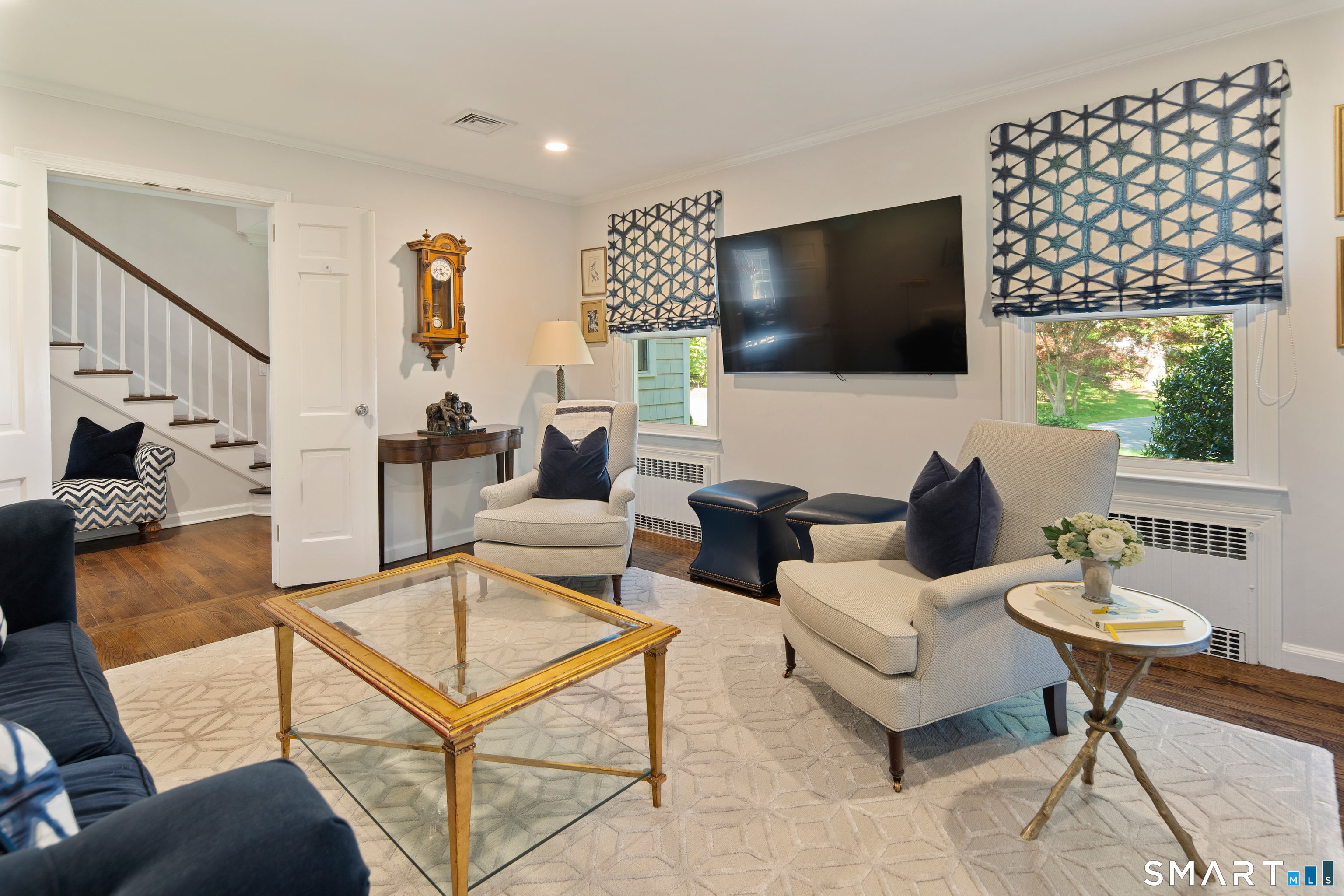 11 McLaren Road South Darien, CT 06820 - Photo 22 of 40 a living room with furniture and a flat screen tv