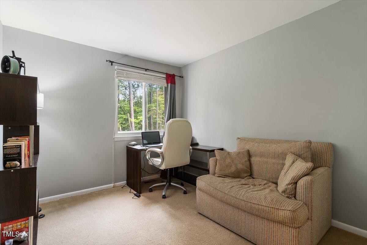 712 Godwin Court Raleigh, NC 27606 - Photo 19 of 27 a living room with furniture and a window