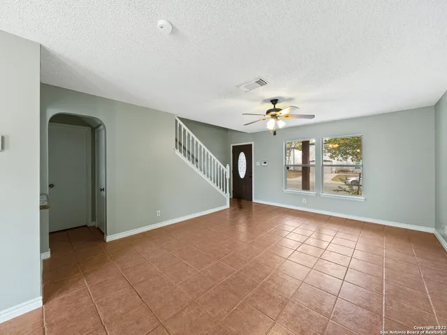 a view of an empty room with a window