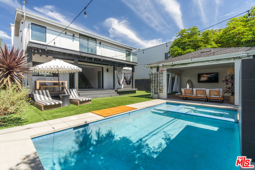 a view of a house with backyard porch and patio
