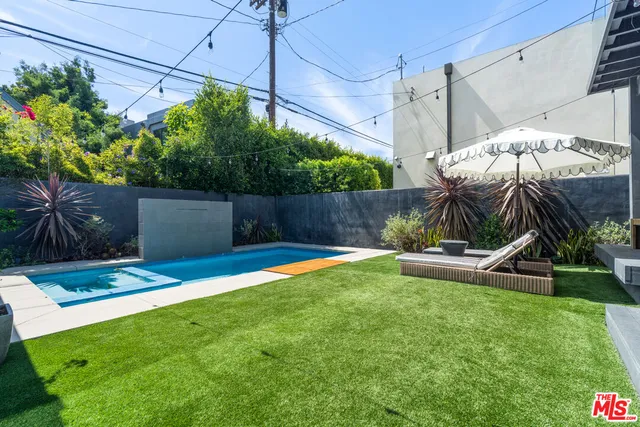a view of a porch and garden