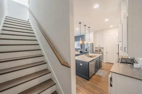 a view of kitchen with sink and stove