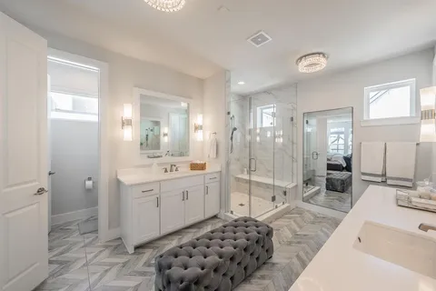 a bathroom with a sink a toilet and a mirror