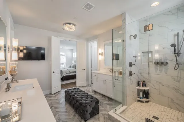 a walk in closet and a bathroom