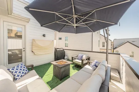 a view of balcony with furniture