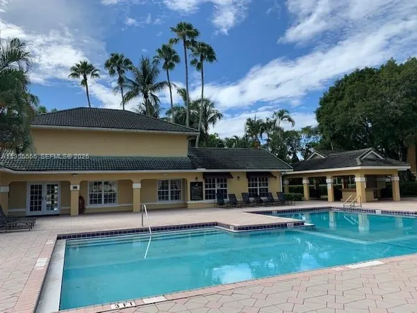 front view of a house with a swimming pool