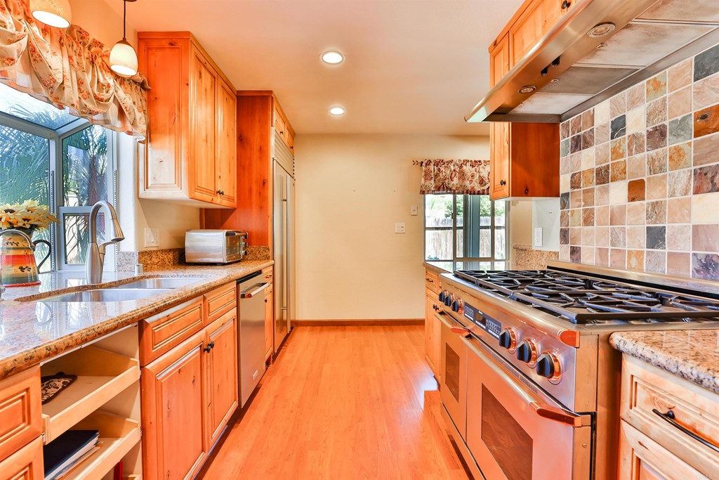 14229 Frame Road Poway, CA 92064 - Photo 1 of 1 a kitchen with stainless steel appliances a stove a sink and a refrigerator