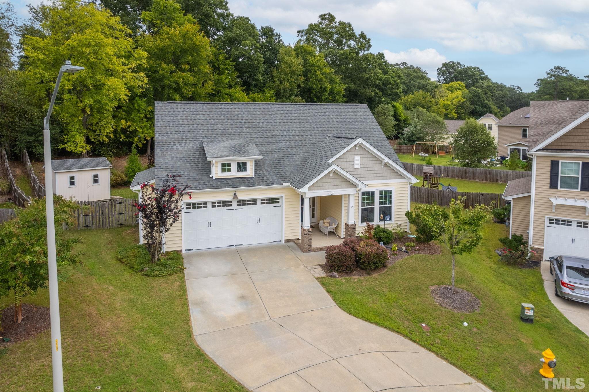 4505 Kennamer Way Knightdale, NC 27545 - Photo 1 of 50 a aerial view of a house with a yard and potted plants