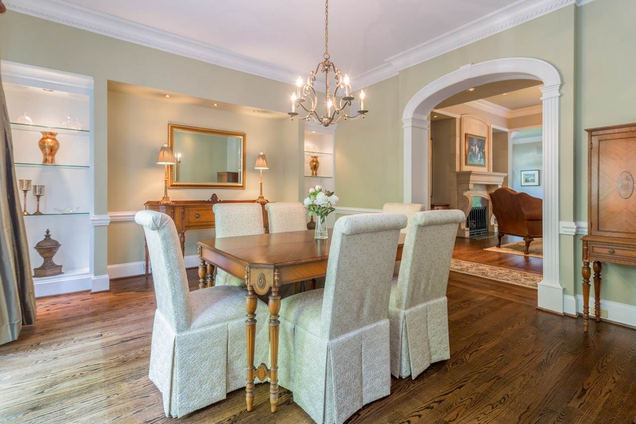 4921 Cremshaw Court Raleigh, NC 27614 - Photo 4 of 25 2 Built in Curio Cabinets with Accent Lighting, Dentil Crown Molding, Hardwood Floors, French Doors to Patio and Large Furniture Alcove Elegant Dining Room