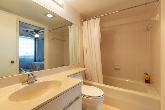 a kitchen with a sink cabinets and stainless steel appliances