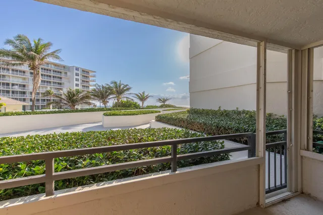 a view of building with cars parked