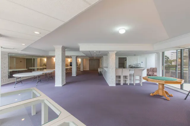 a view of a livingroom with furniture and window