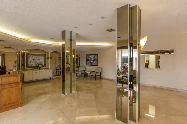 a couple of potted plants in front of door