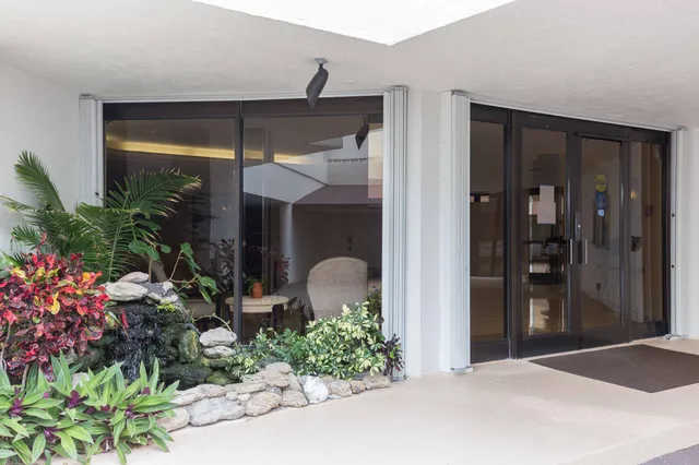 a view of a balcony with wooden floor