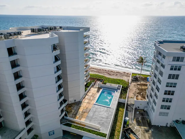 a view of a building with a yard